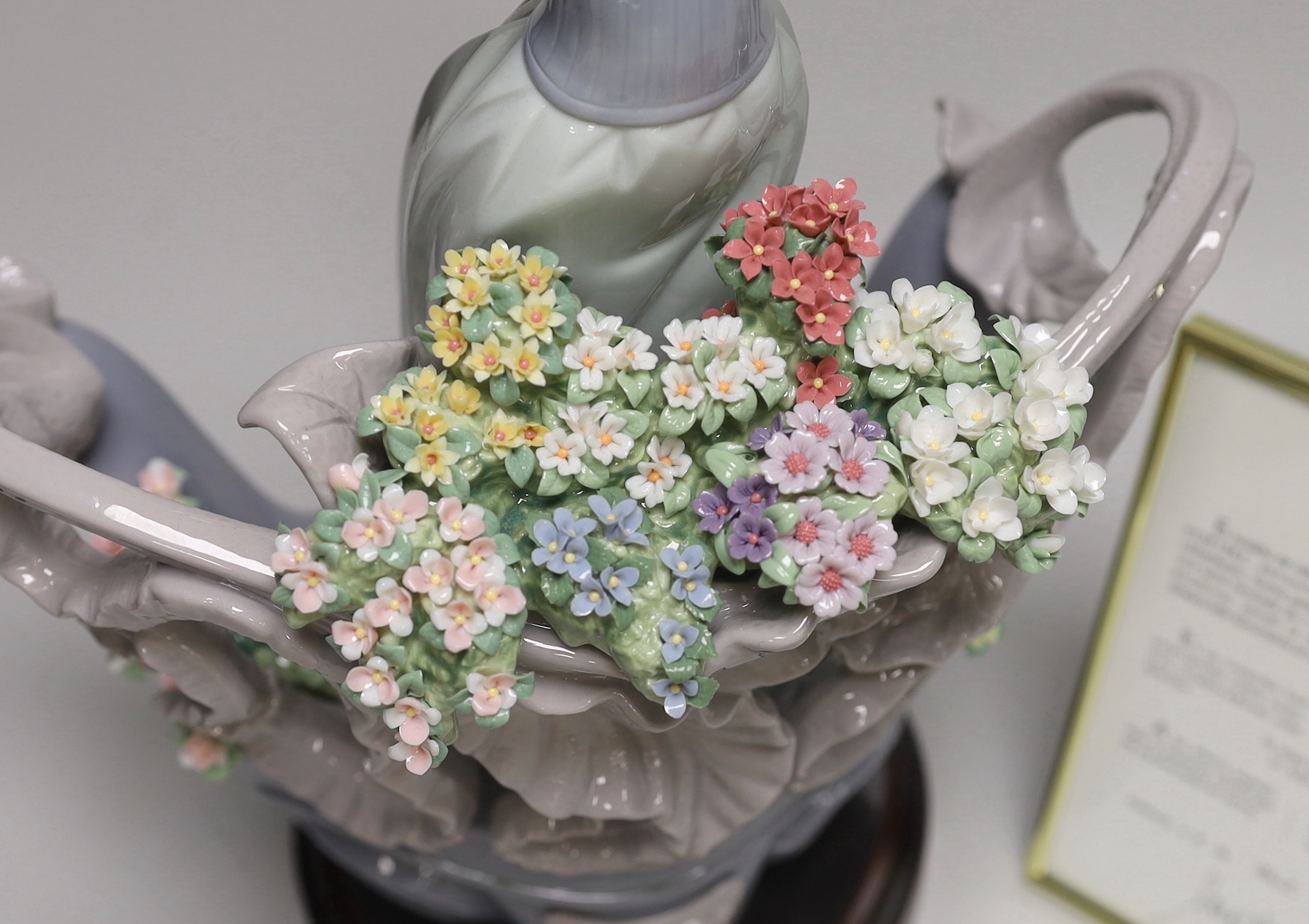 A Lladro porcelain table centrepiece, ‘’Love’s first light’’, number 01862, sculpture Joan Coderch, one of 1500, with original box and certificate, 35cm high